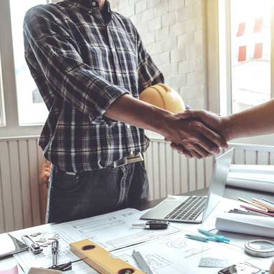 A man shaking hands with another man - Executing Your Transition Plan